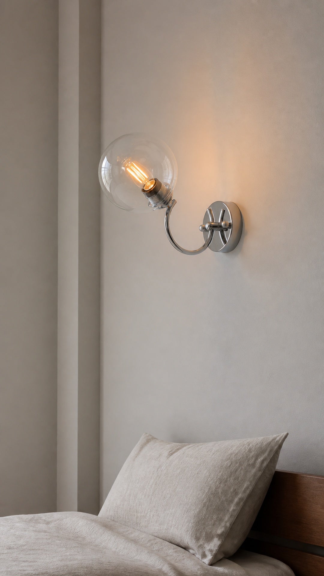 Halo Arc clear-glass wall sconce hero