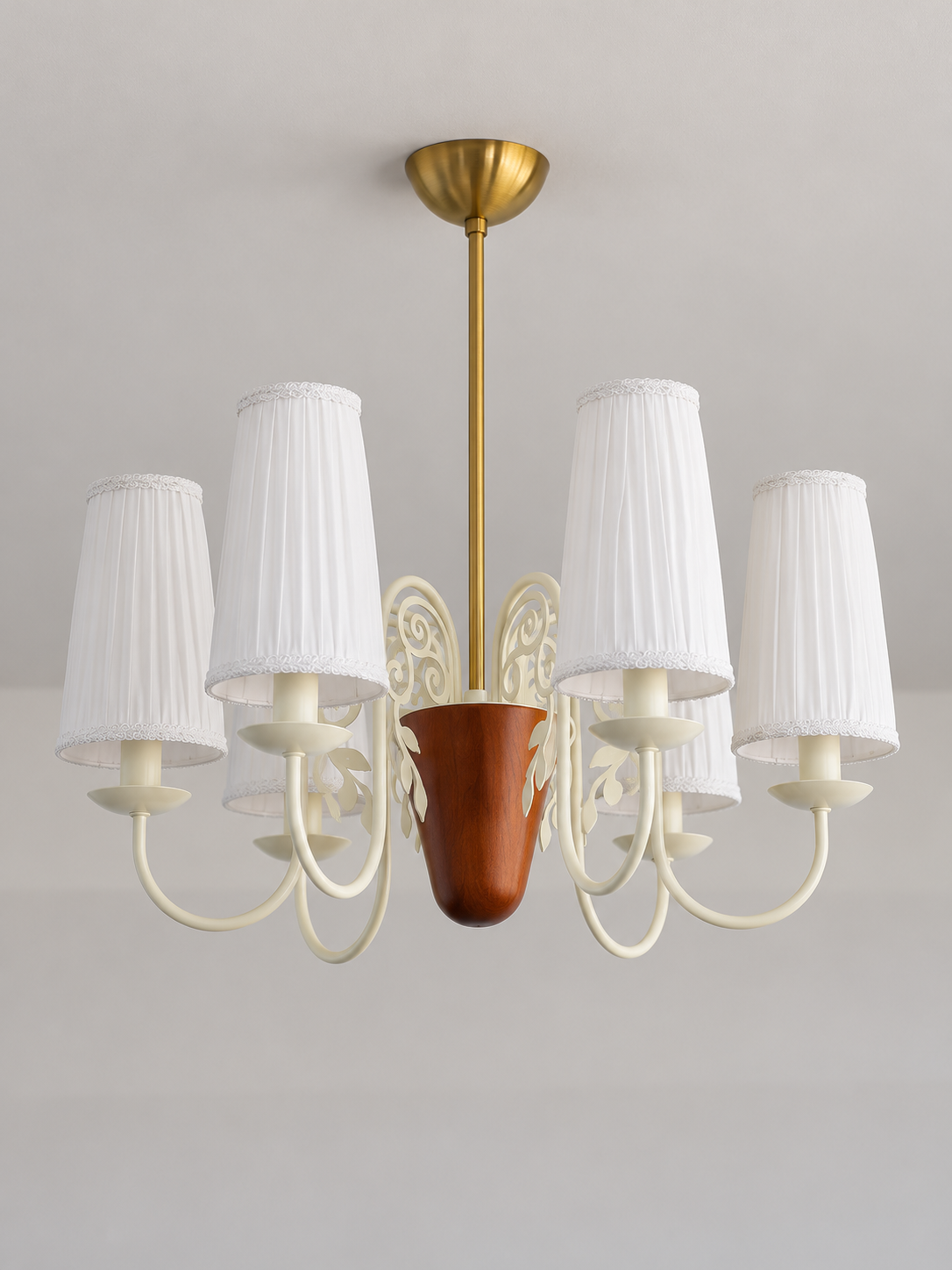 Scroll-arm chandelier with 6 white pleated fabric shades, shown unlit, product view