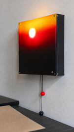 Dusk Orbit wall light acrylic panel and matte housing detail