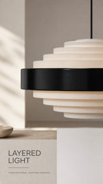 Noir Step Pendant close-up of frosted white stepped diffuser and smooth black metal band
