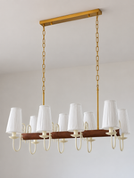 Scroll-arm chandelier with 8 white pleated fabric shades, shown unlit, product view