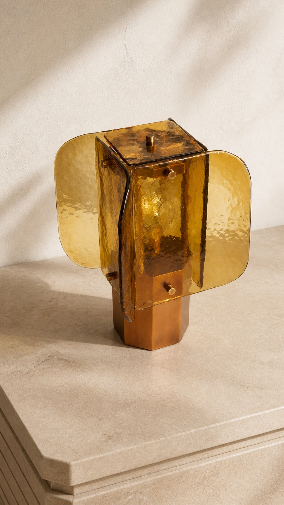 Three-quarter view of Amber Grid table lamp showing the rounded-square glass enclosure