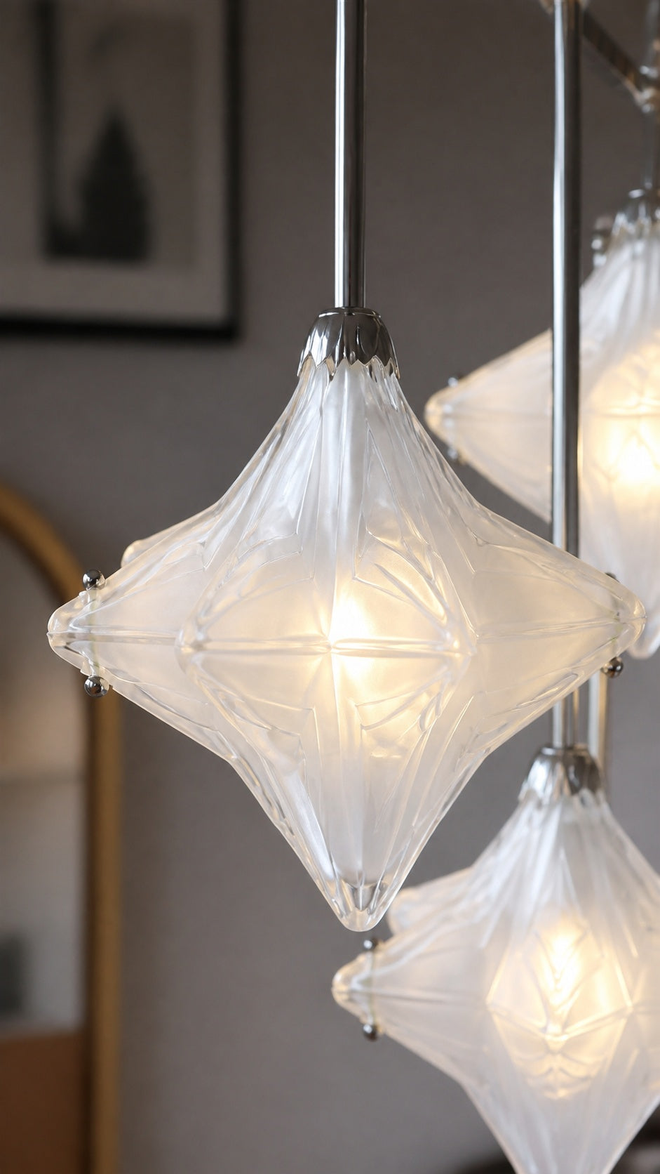 Close-up of faceted clear glass shade and metal cap