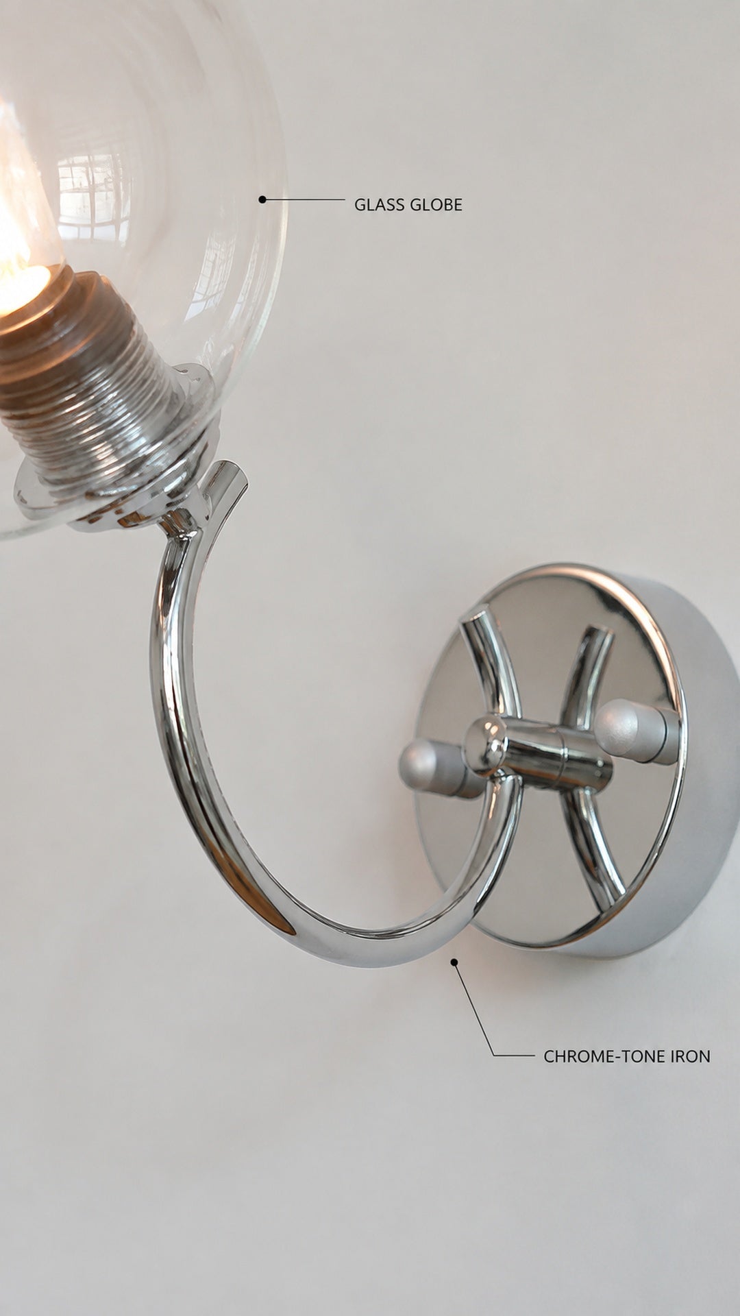 Chrome-tone iron and glass globe detail
