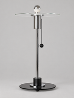 Clear glass disc table lamp with half-chrome bulb finish and chrome-tone fittings, shown unlit