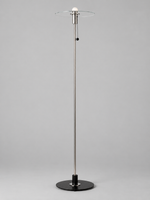Clear glass disc floor lamp with milky-white bulb finish and chrome-tone fittings, shown unlit