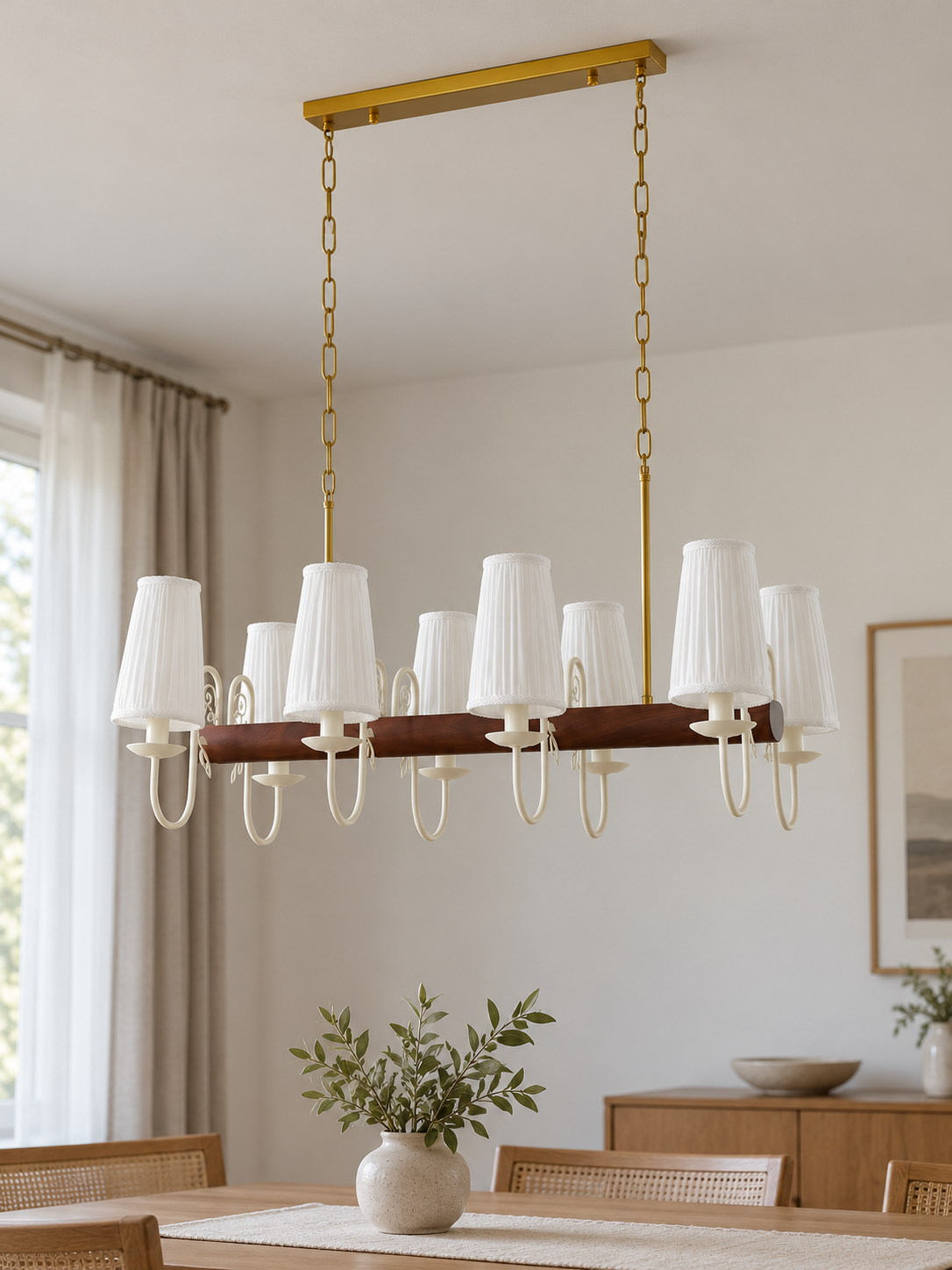 Scroll-arm chandelier with 8 white pleated fabric shades, shown unlit, daylight dining-room setting
