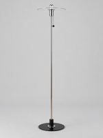 Clear glass disc floor lamp with half-chrome bulb finish and chrome-tone fittings, shown unlit