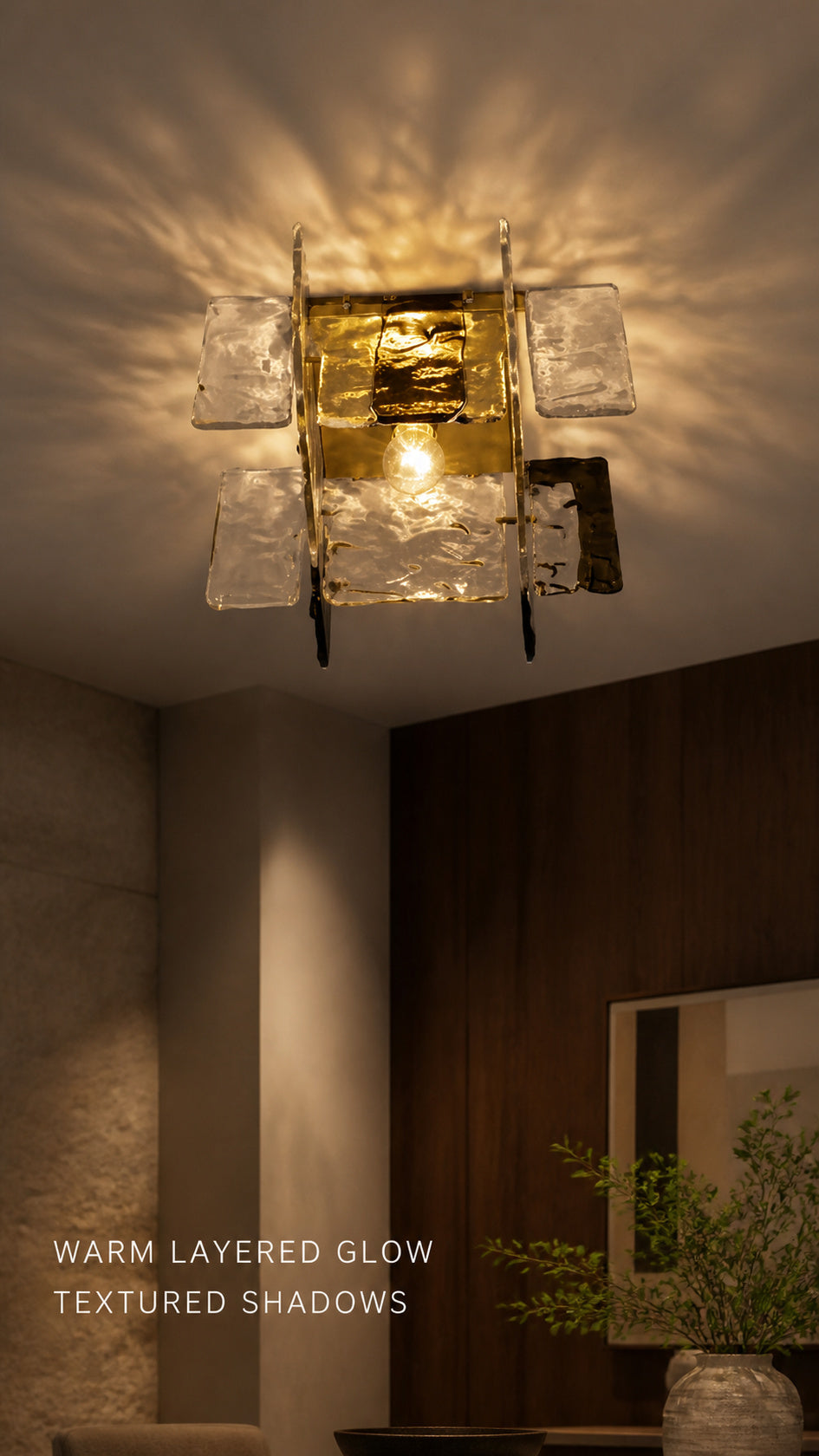 Glass Orbit ceiling light creating warm layered shadows on a ceiling
