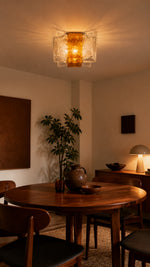 Tidal Petal Amber Clear in a warm modern dining room