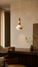 Colorful Memphis pendant above a compact dining counter