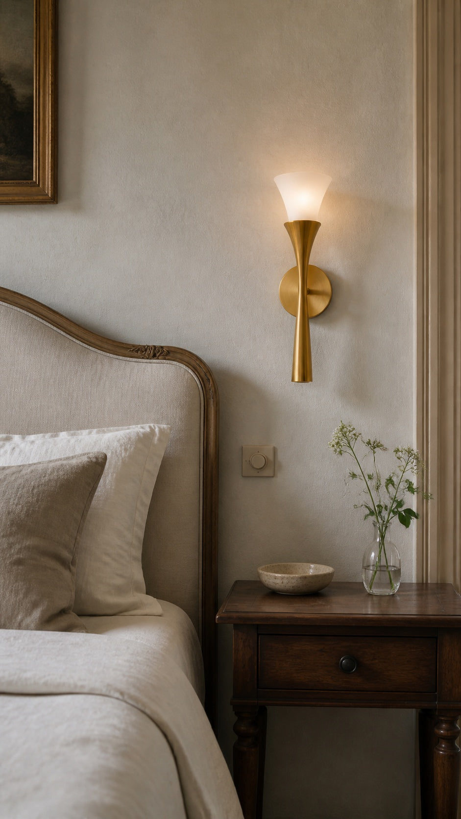 Fleur Nocturne wall sconce beside a French-vintage bed