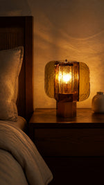 Amber Grid table lamp in a warm bedroom evening setting