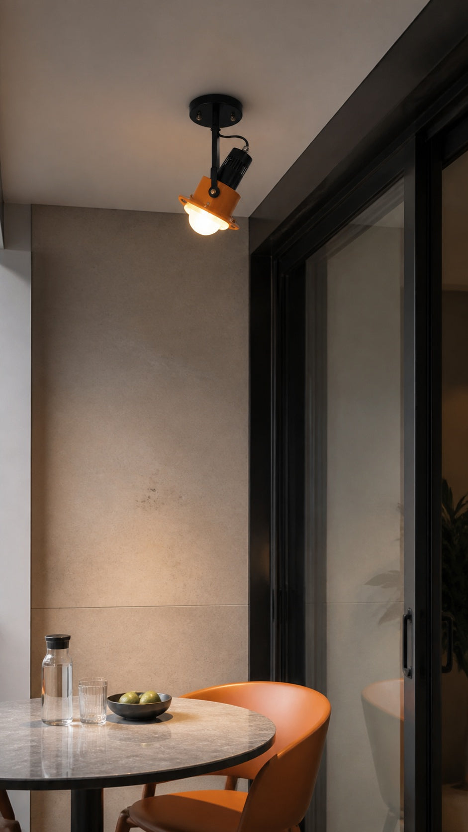 Surface-mounted spotlight at a balcony dining threshold