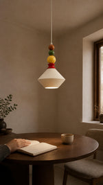 Color Orbit Light above a compact reading table