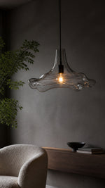 Smoke gray pendant in a modern reading lounge