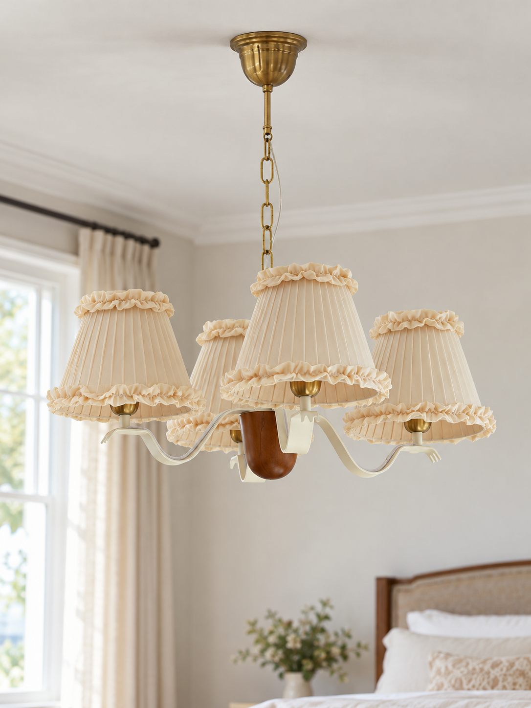 Round 4-light chandelier with cream ruffled fabric shades, shown switched off in daylight