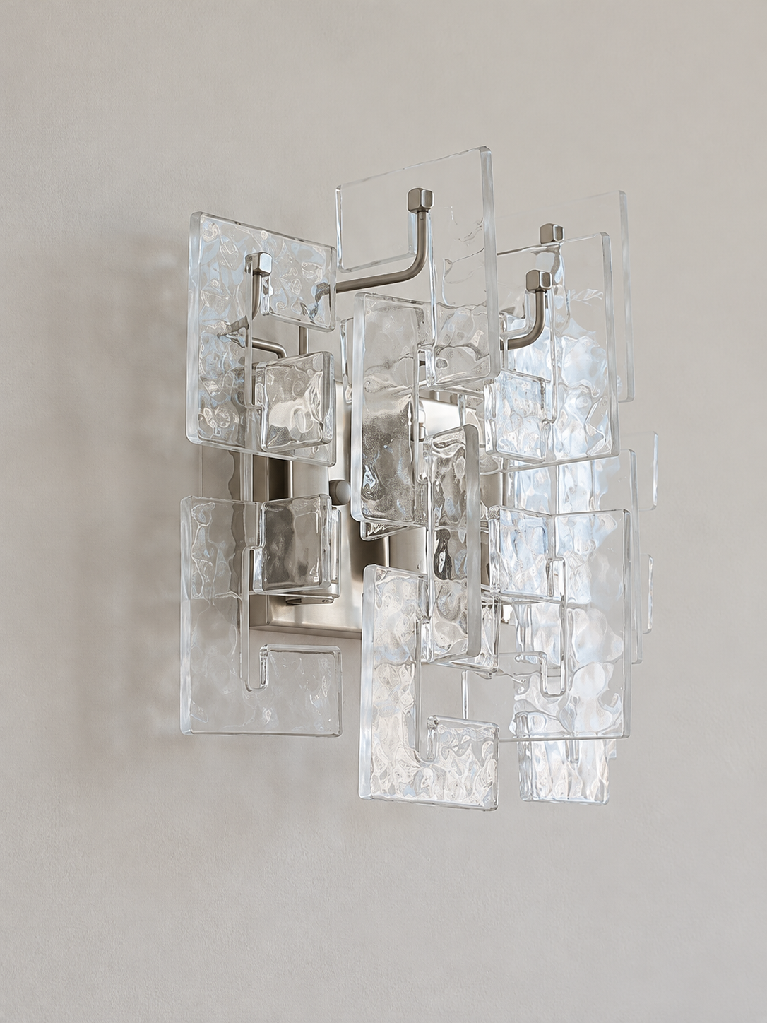 Satin Nickel wall sconce with clear textured glass panels, shown switched off in daylight