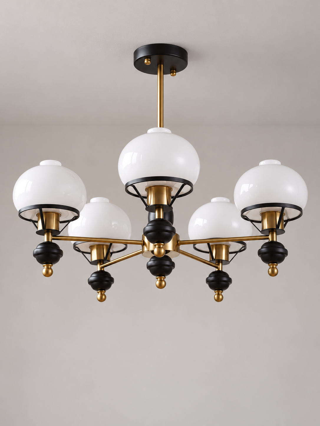 Black and copper-tone 5-light chandelier with white glass shades and bell finials, shown switched off