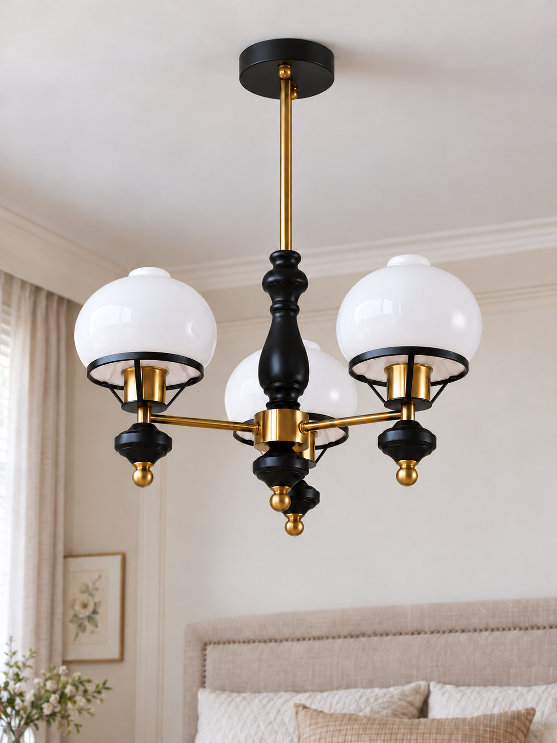Black and copper-tone 3-light chandelier with white glass shades and ribbed finials, shown switched off