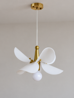 Small 32 cm copper-tone and white acrylic petal pendant, switched off in a neutral studio