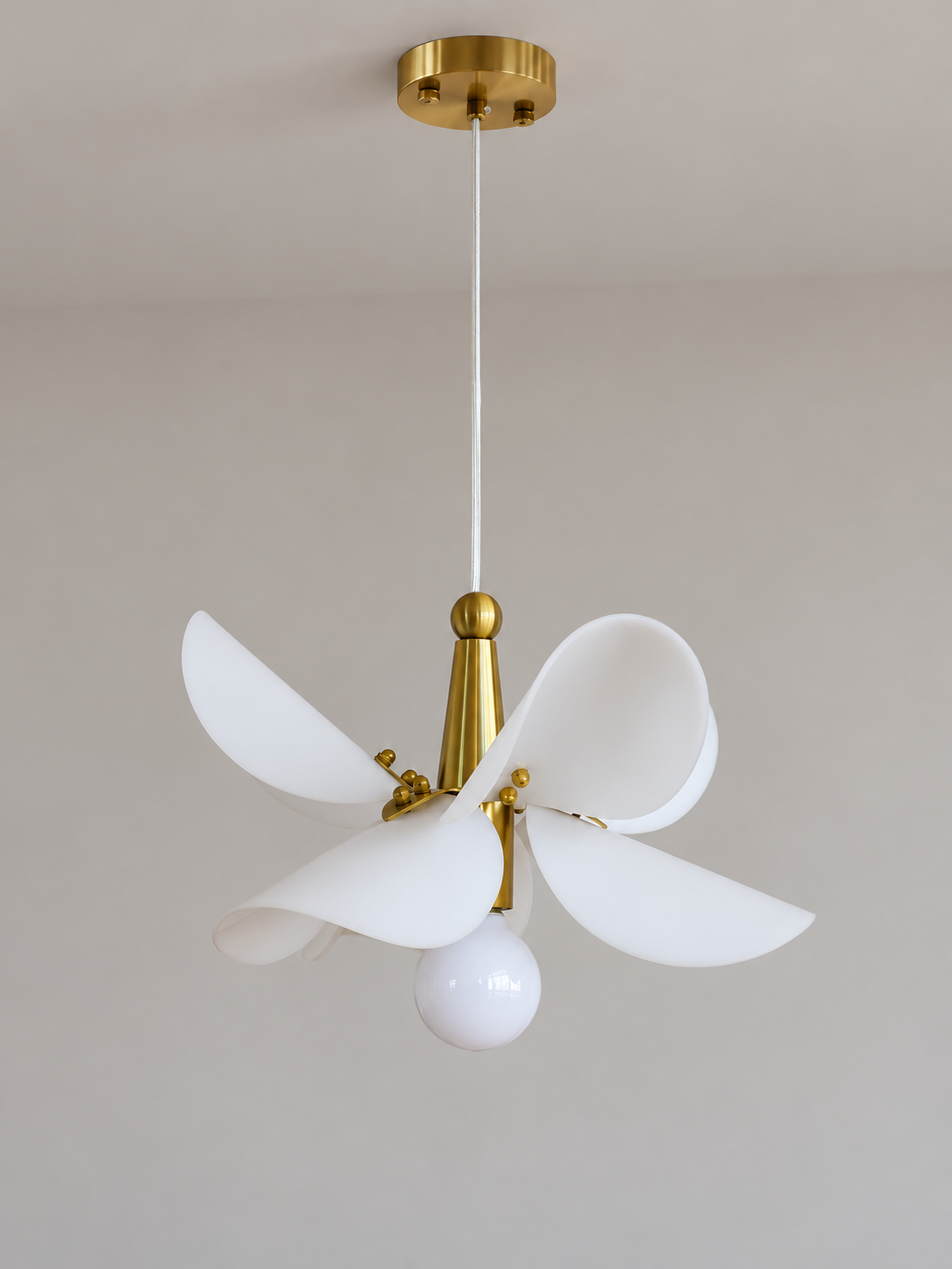 Small 32 cm copper-tone and white acrylic petal pendant, switched off in a neutral studio