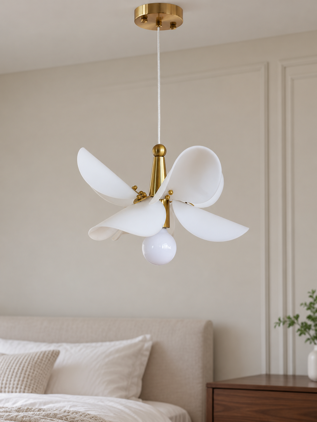 Small 32 cm white acrylic petal pendant with copper-tone frame, switched off beside a daylight bedroom