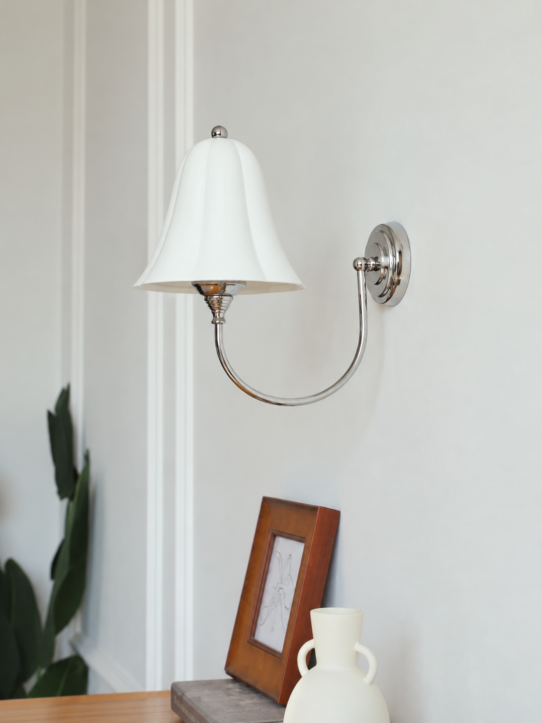 Chrome-tone ceramic bell wall light room view, lamp off
