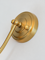 Copper-tone wall light backplate detail