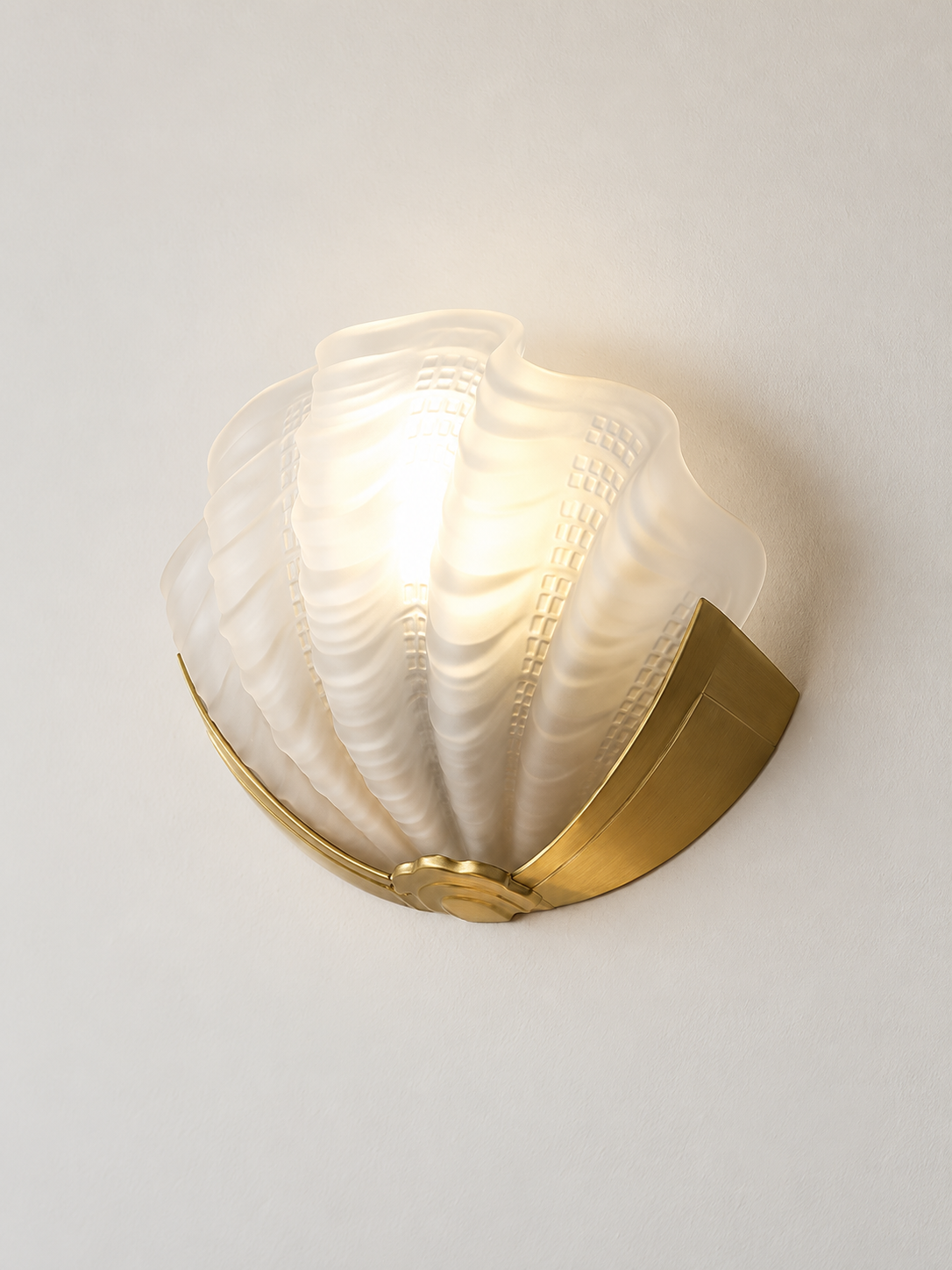 frosted white glass shell wall sconce with copper-tone mount