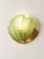 green glass shell wall sconce with copper-tone mount