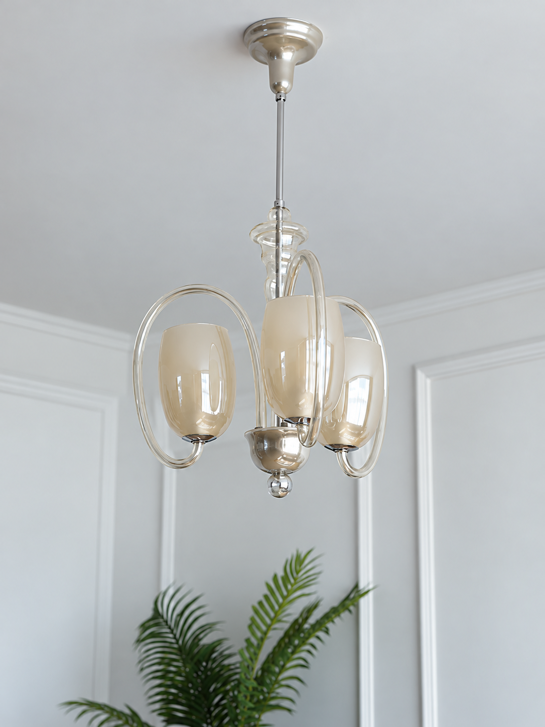 Champagne glass oval loop chandelier in a room