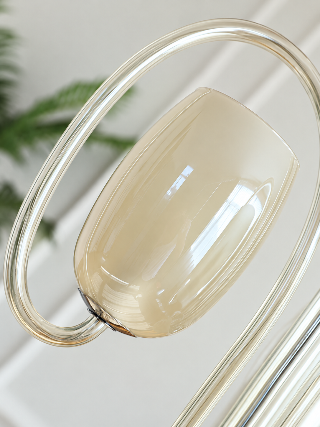 Chrome-tone chandelier fitting and glass detail