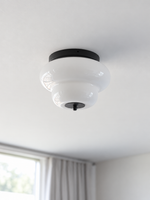 Black rounded tier white glass ceiling light in a room setting