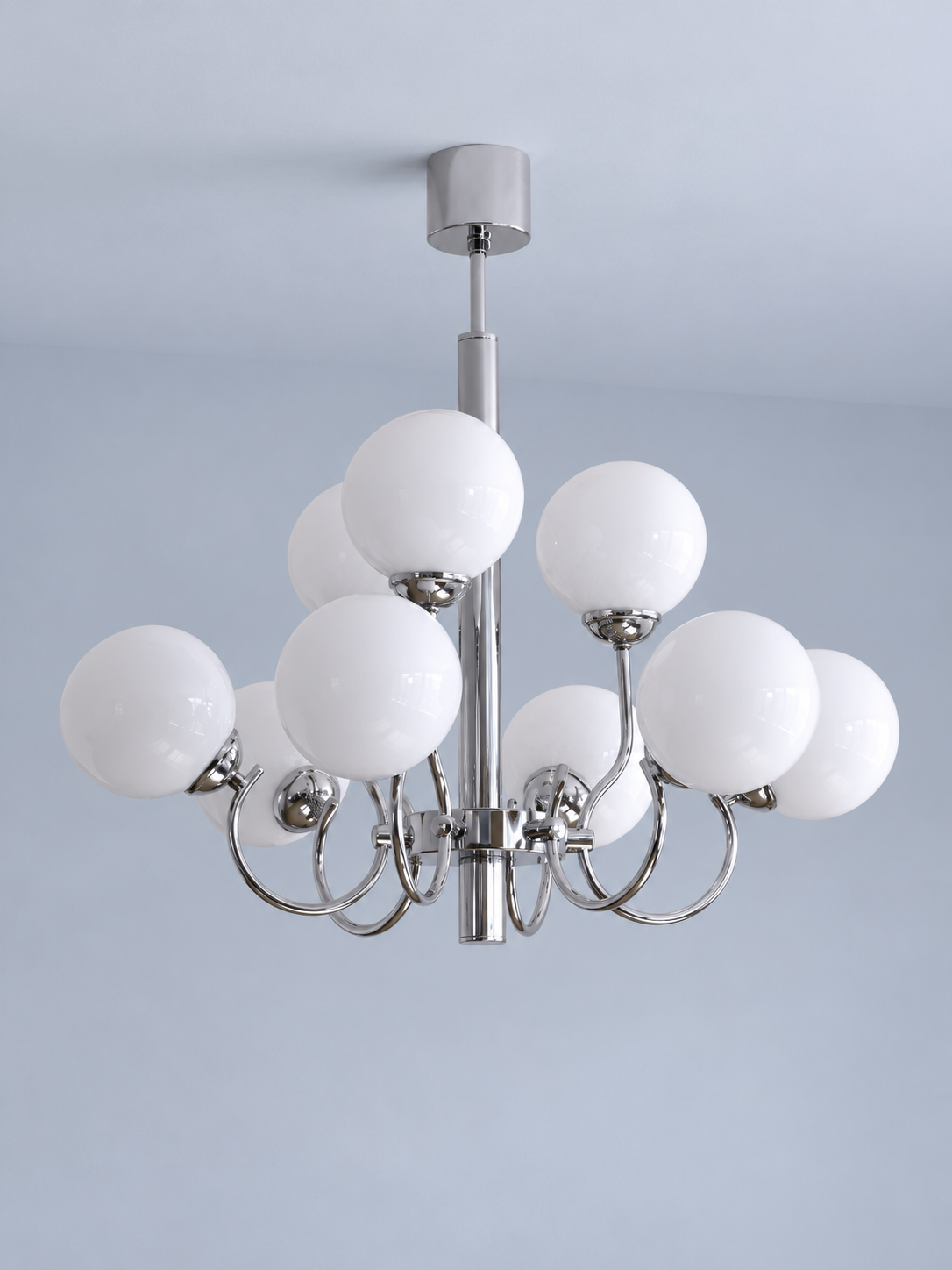 Chrome and white glass nine-light chandelier, shown switched off in a cool-gray studio