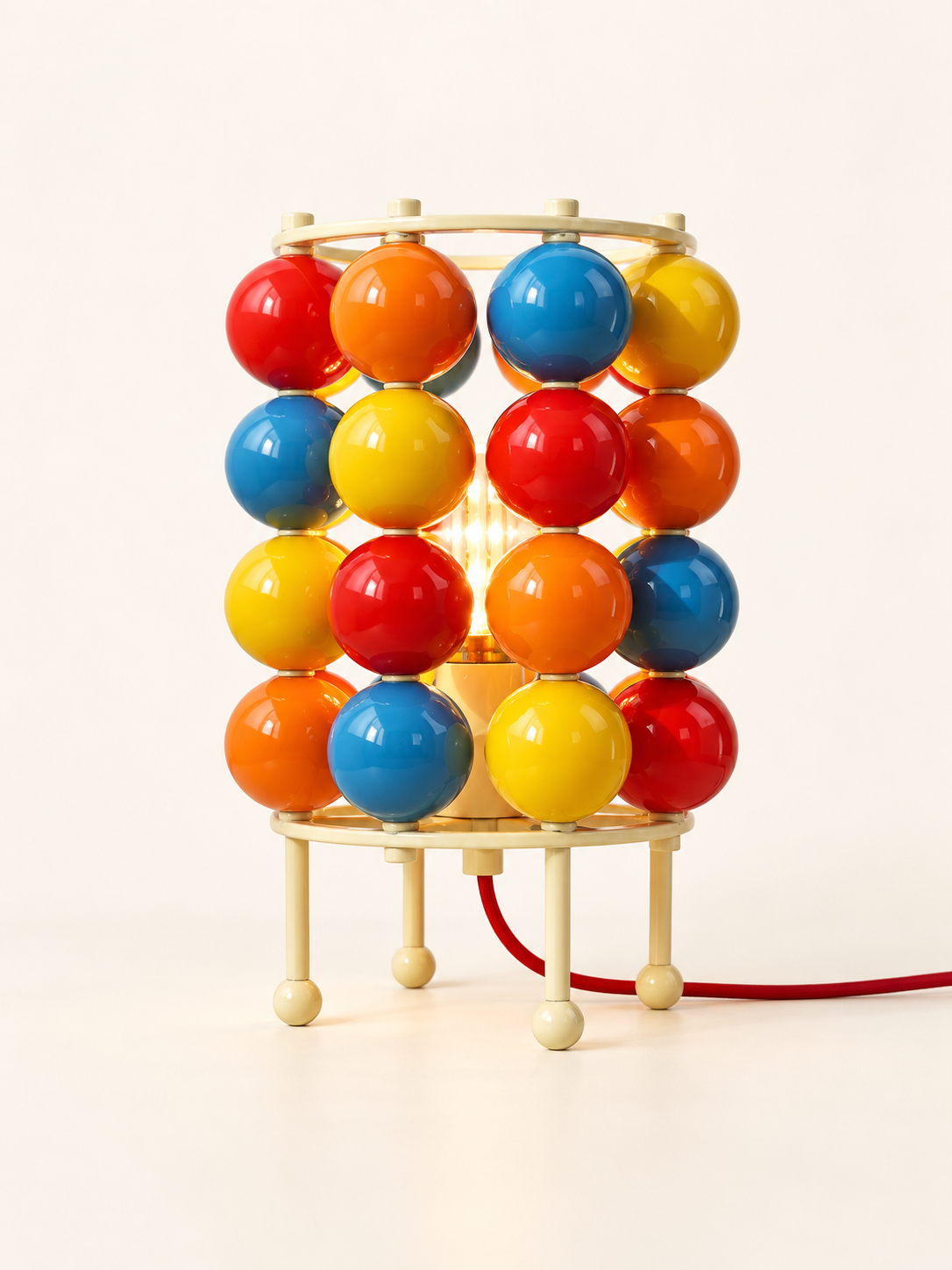 Colorful sphere table sku with cream metal frame and red cord