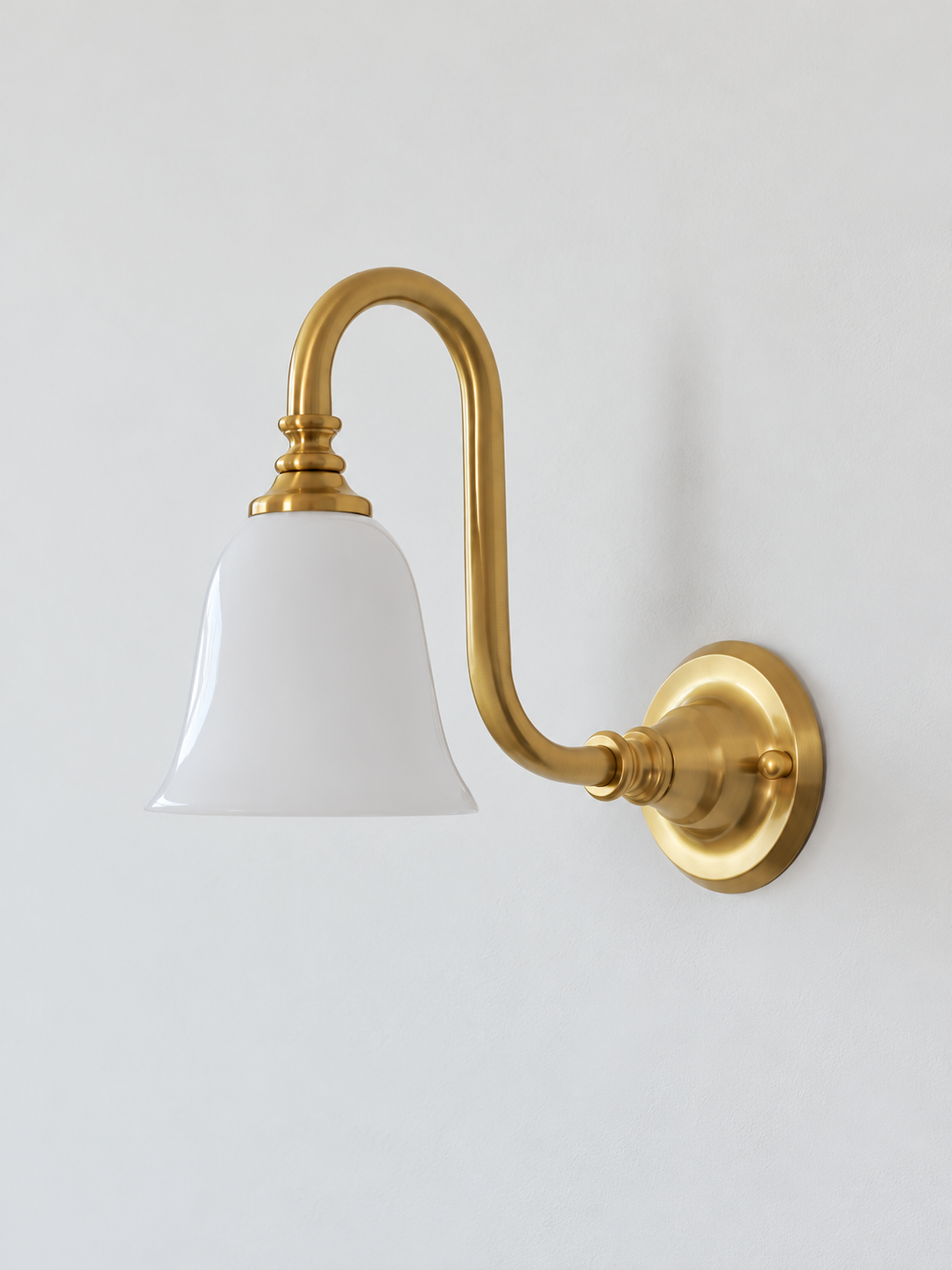 Copper-Tone bent arm wall sconce with a white glass shade, shown unlit