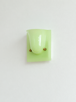 Green single head resin cup wall sconce with gold-tone fasteners, shown unlit