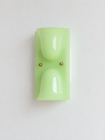 Green double head resin cup wall sconce with gold-tone fasteners, shown unlit