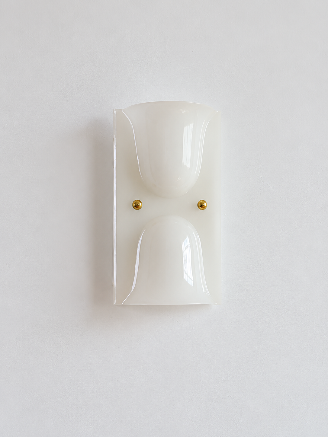White double head resin cup wall sconce with gold-tone fasteners, shown unlit