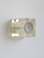 Antique Silver resin brick wall sconce with pale-yellow resin and textured circular cap, shown unlit, product view