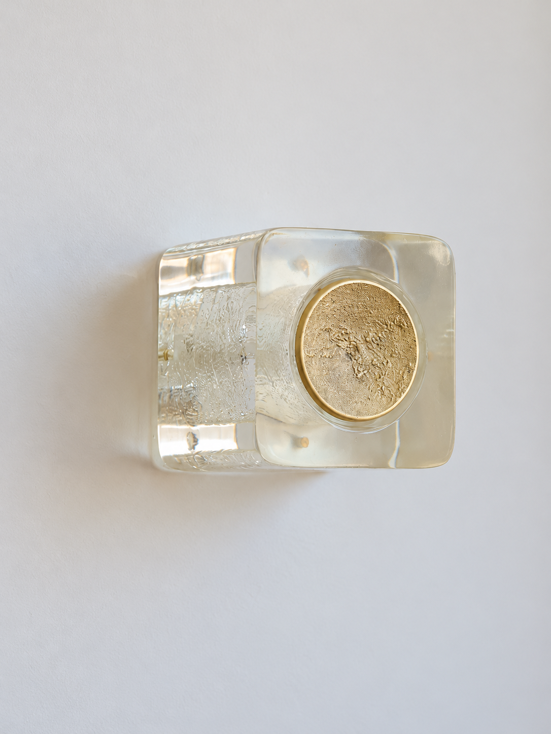 Antique Copper resin brick wall sconce with pale-yellow resin and textured circular cap, shown unlit, product view