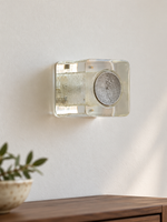 Antique Silver resin brick wall sconce with pale-yellow resin and textured circular cap, shown unlit, daylight console setting