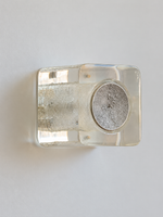 Antique Silver resin brick wall sconce with pale-yellow resin and textured circular cap, shown unlit, material detail