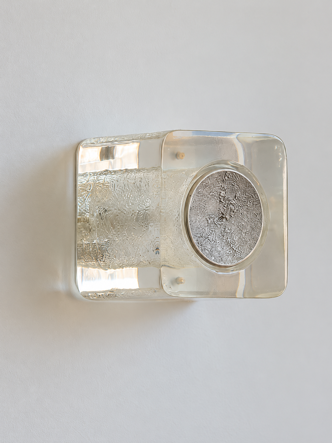 Antique Silver resin brick wall sconce with pale-yellow resin and textured circular cap, shown unlit, material detail