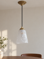 Copper-Tone pendant with translucent patterned glass cone, shown unlit, daylight dining-room setting