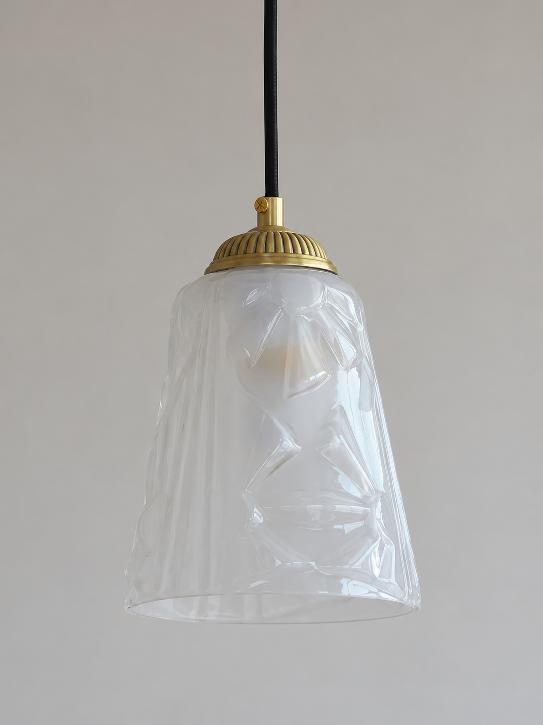 Copper-Tone pendant with translucent patterned glass cone, shown unlit, shade detail