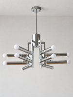 Chrome geometric12-light chandelier with milk white light sources, shown unlit in a detail composition