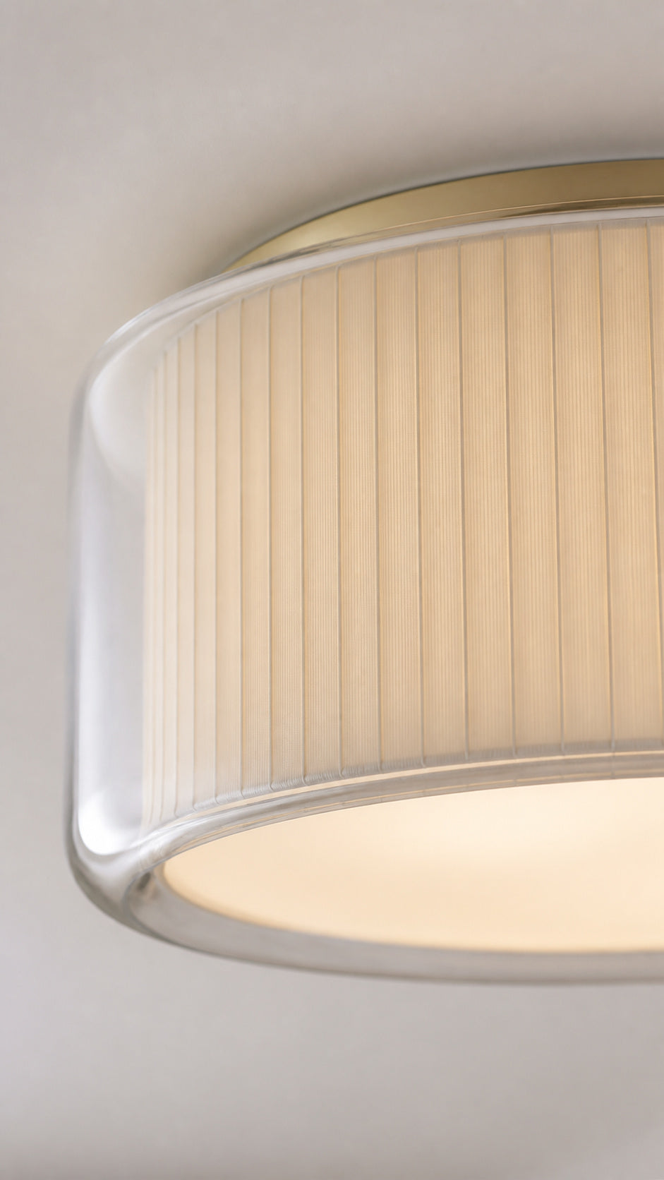 Close-up of the Mercer clear glass rim, ribbed diffuser, and champagne-tone ring