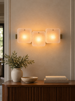 Frosted Glass Wall Sconce in a refined interior, 3:4 scene hero